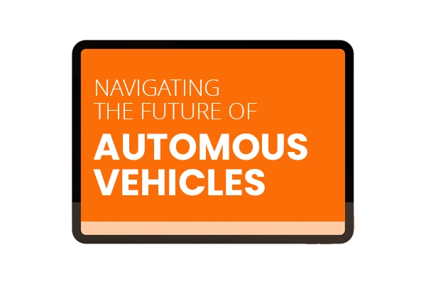 Foto van een omlijsting van Macbook met oranje achtergrond en de tekst navigating the future of automous vehicles