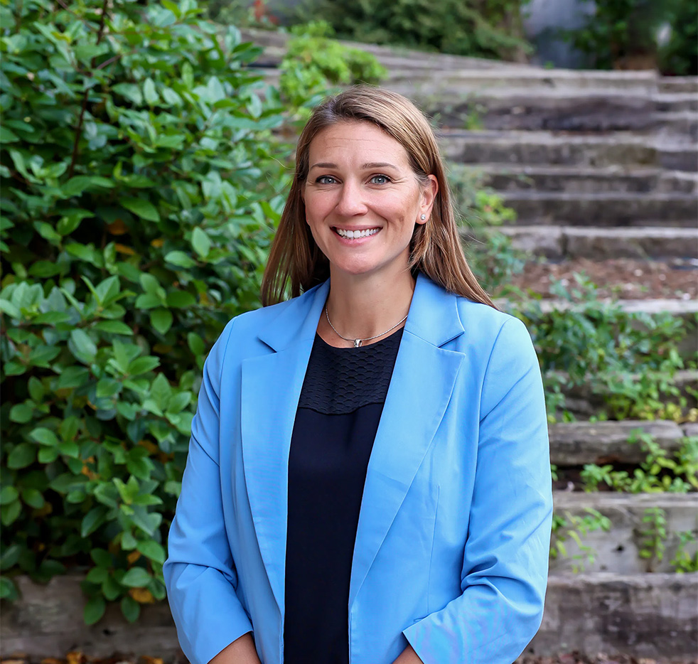 Portrait of Linzy Schaller with a blue jacket outside